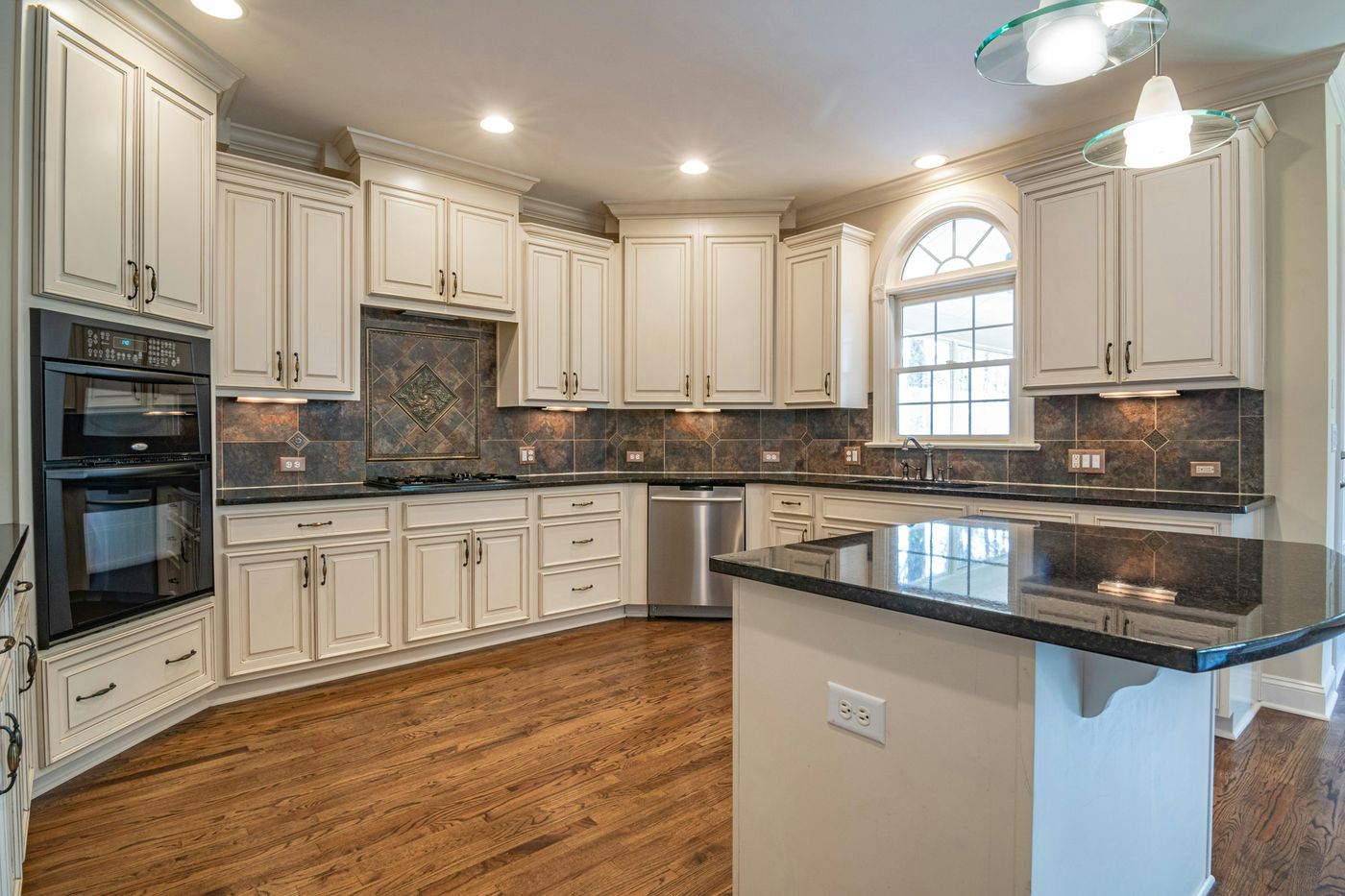 Premium kitchen remodel — white shaker cabinets, marble counter